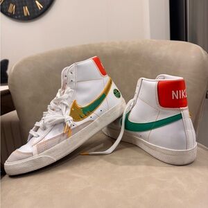Nike High-Top Sneakers with Green and Gold Accents